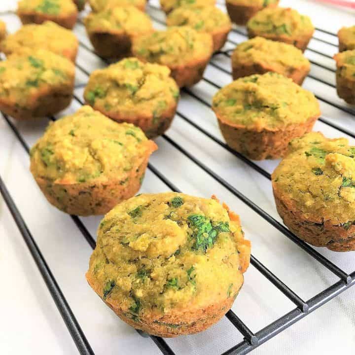 spinach banana muffins on cooling rack on a side angle