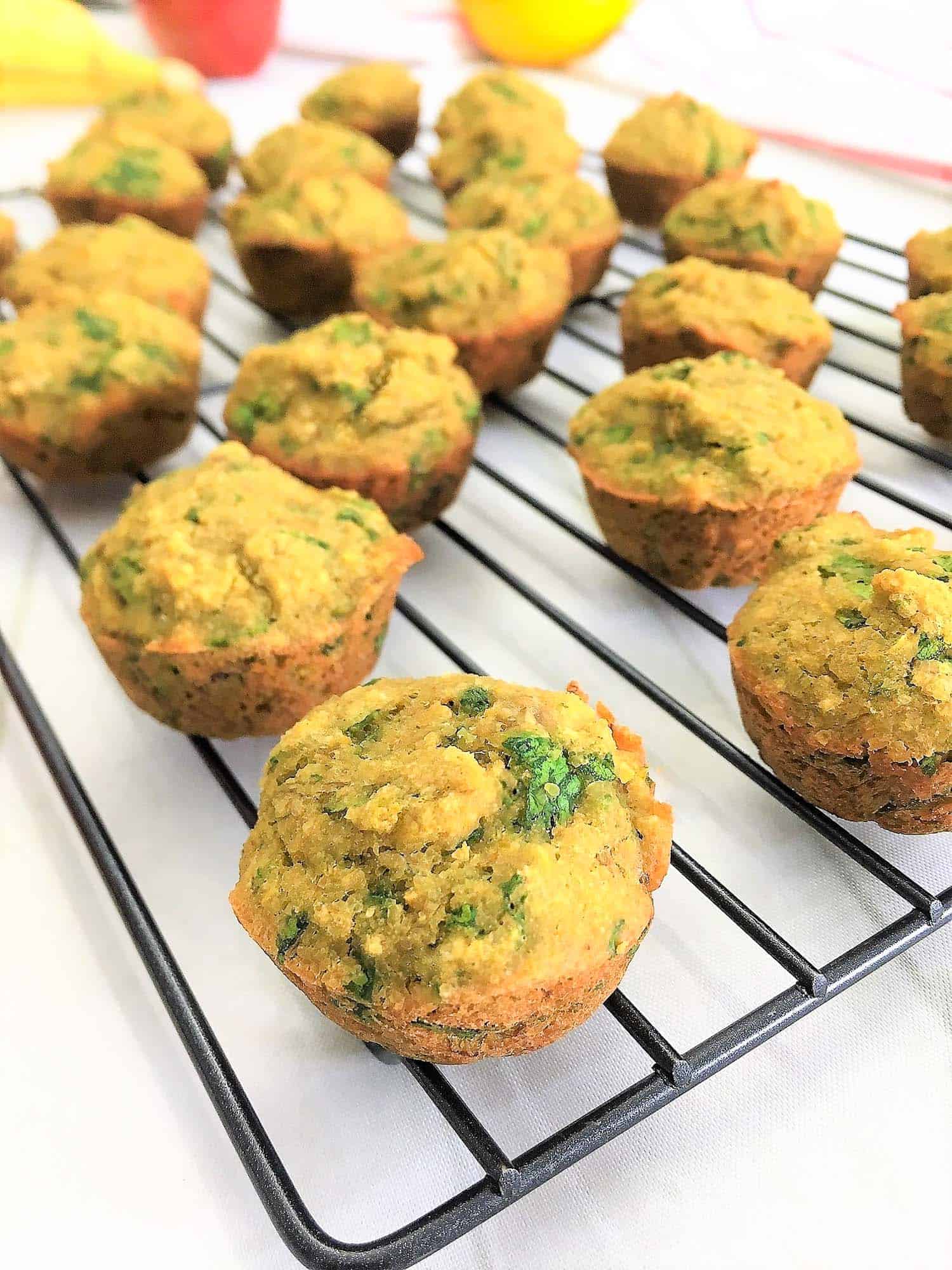 spinach banana muffins on cooling rack on a side angle
