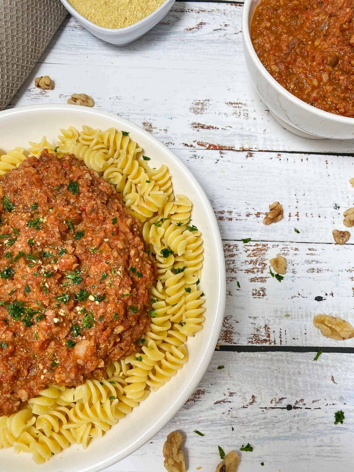plate of pasta with bolognese sauce and parsley on top