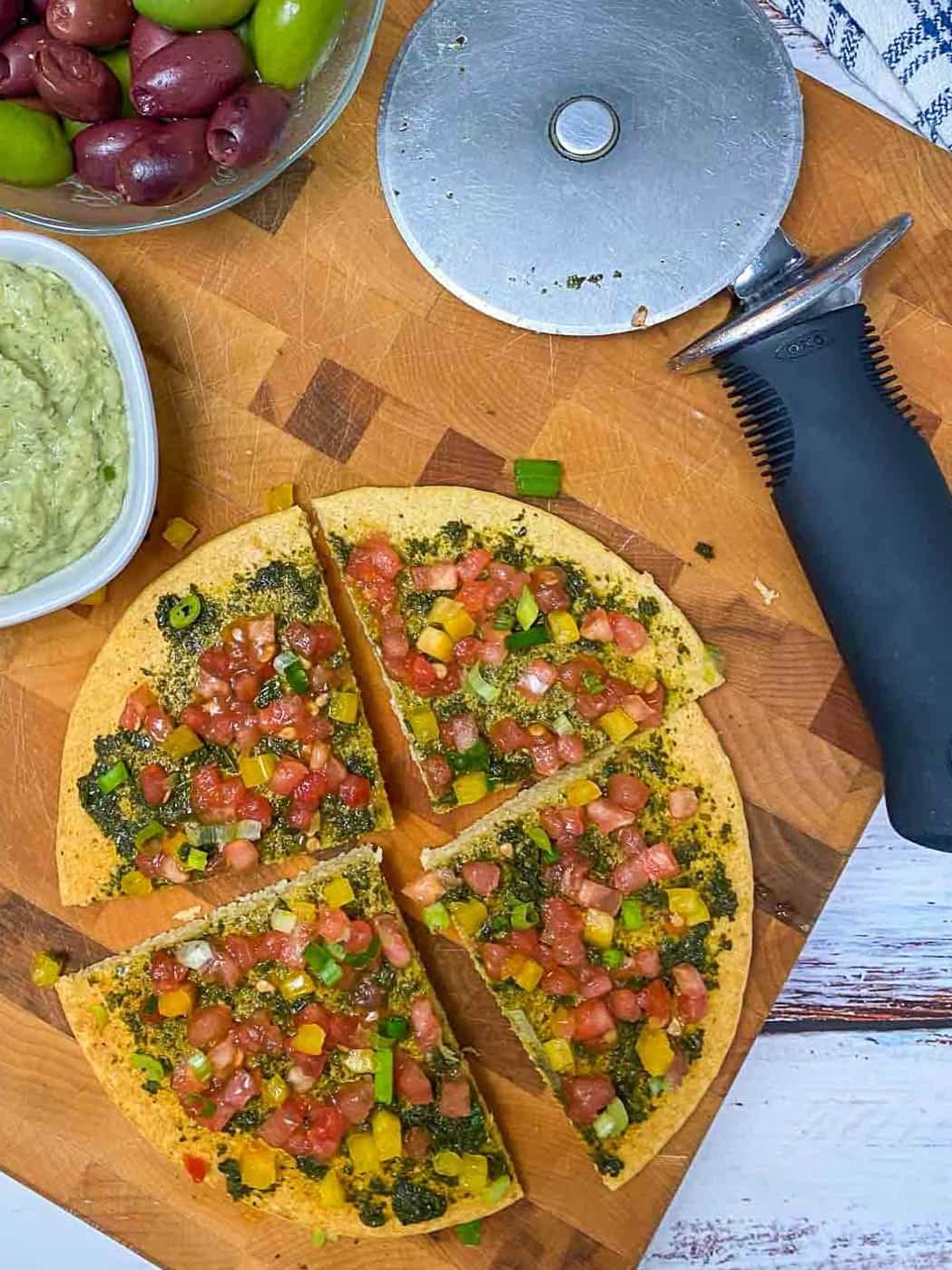 sliced pizza on cutting board
