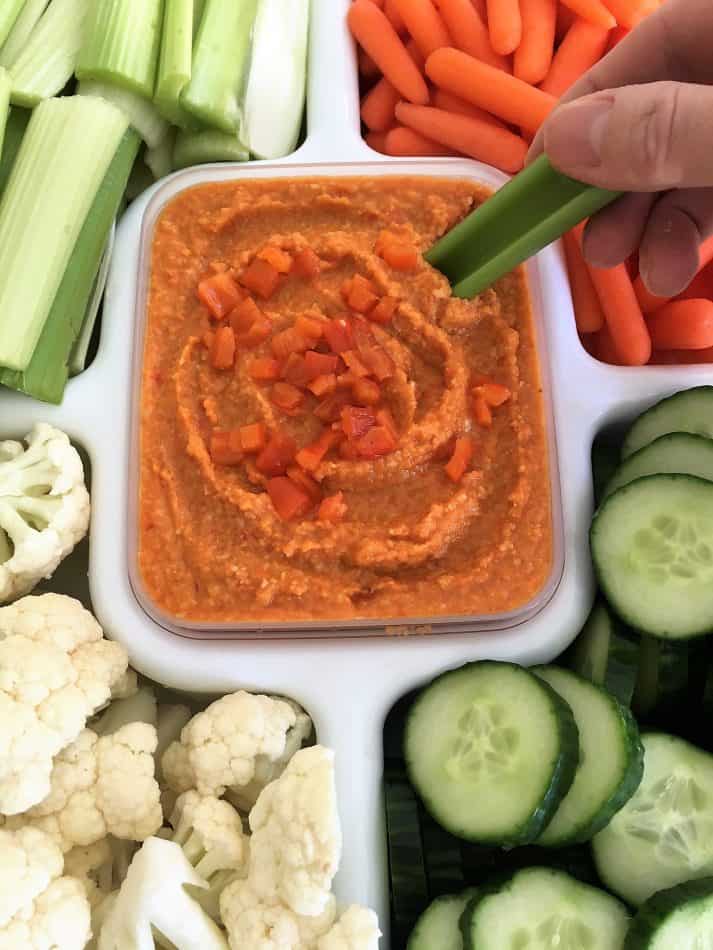 Roasted red pepper hummus with hand dipping celery stick