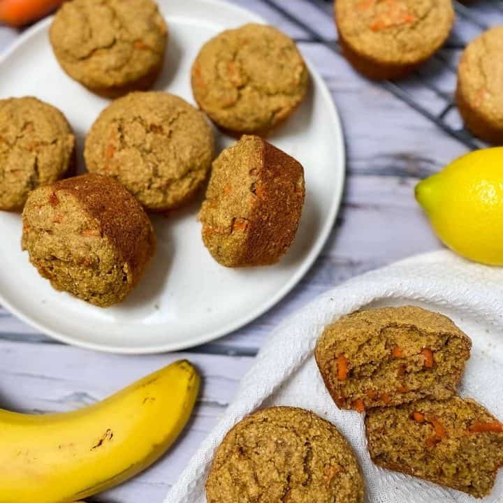 plate of banana carrot muffins with banana and lemon beside it
