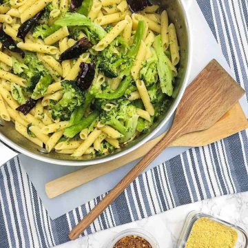 pasta with hot peppers and broccoli in skillet.