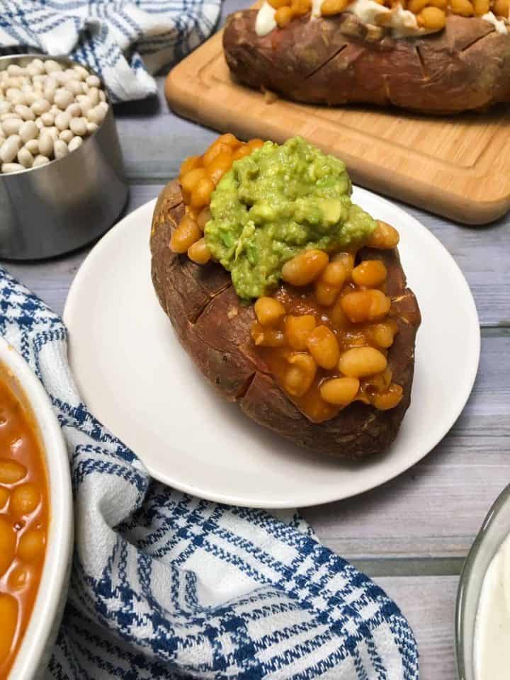 loaded sweet potato stuffed with baked beans and guacamole