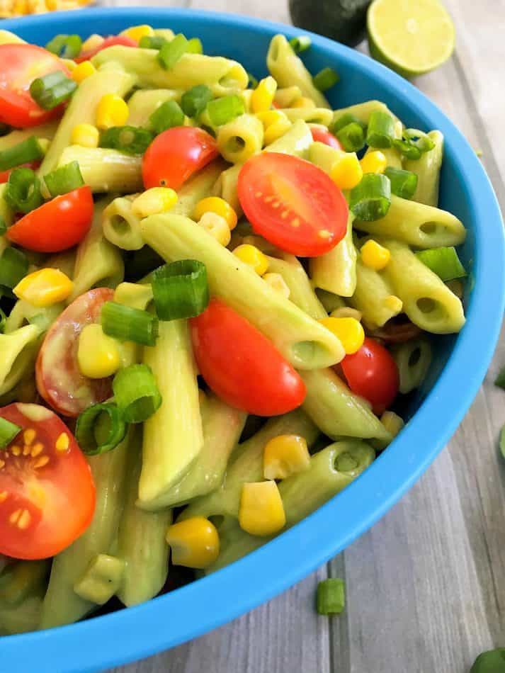 close up of pasta salad in blue bowl