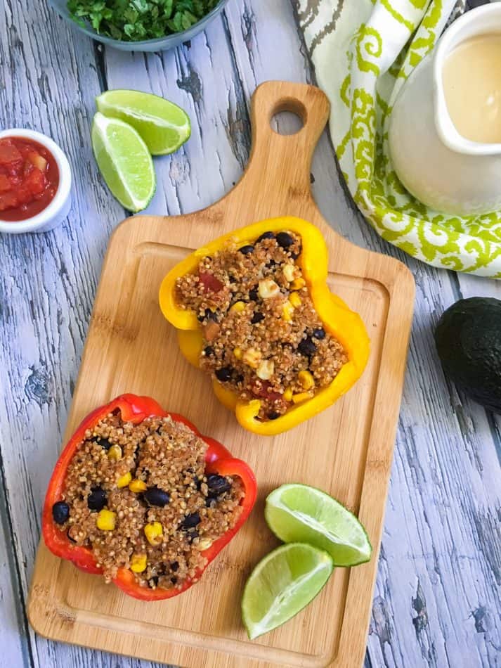 two pepper halves stuffed with quinoa, corn and black beans