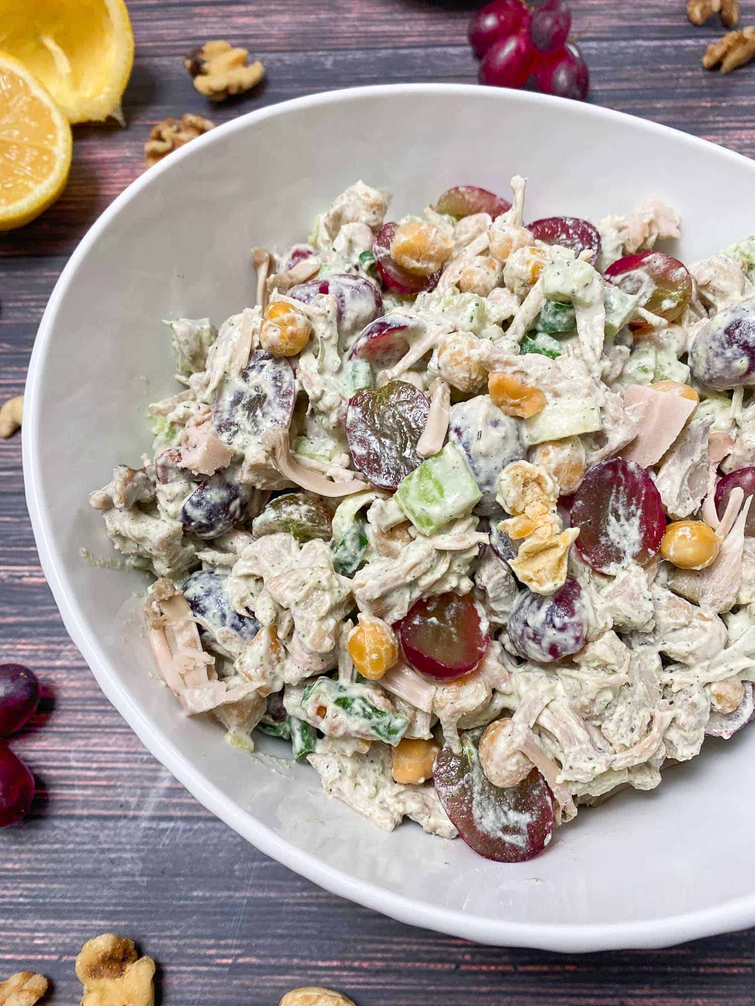 vegan chicken salad in white serving bowl with creamy dressing