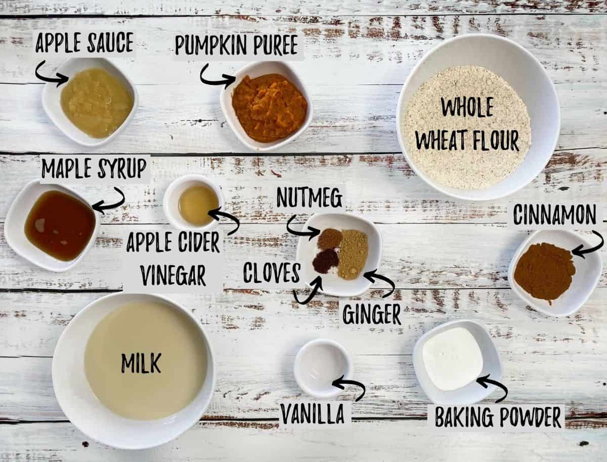 Ingredients to make vegan pumpkin pancakes scattered on deck.