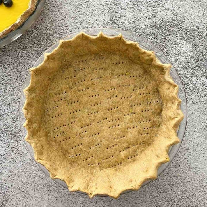 cooked pie crust in pie plate.