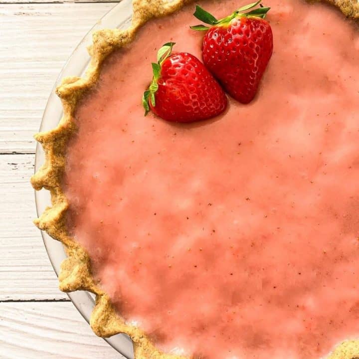 Close up of strawberry pie in pie plate.