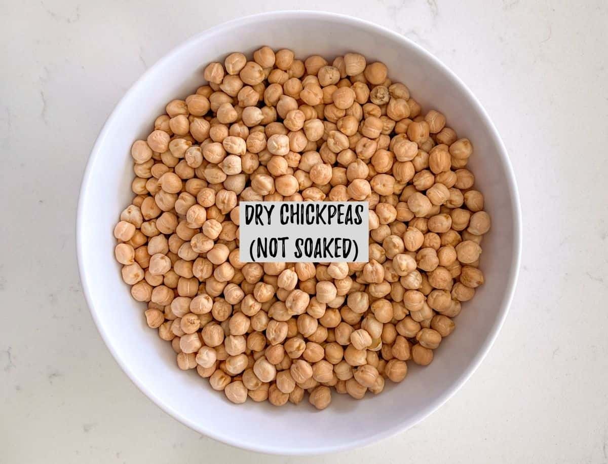 Bowl of dried uncooked chickpeas.