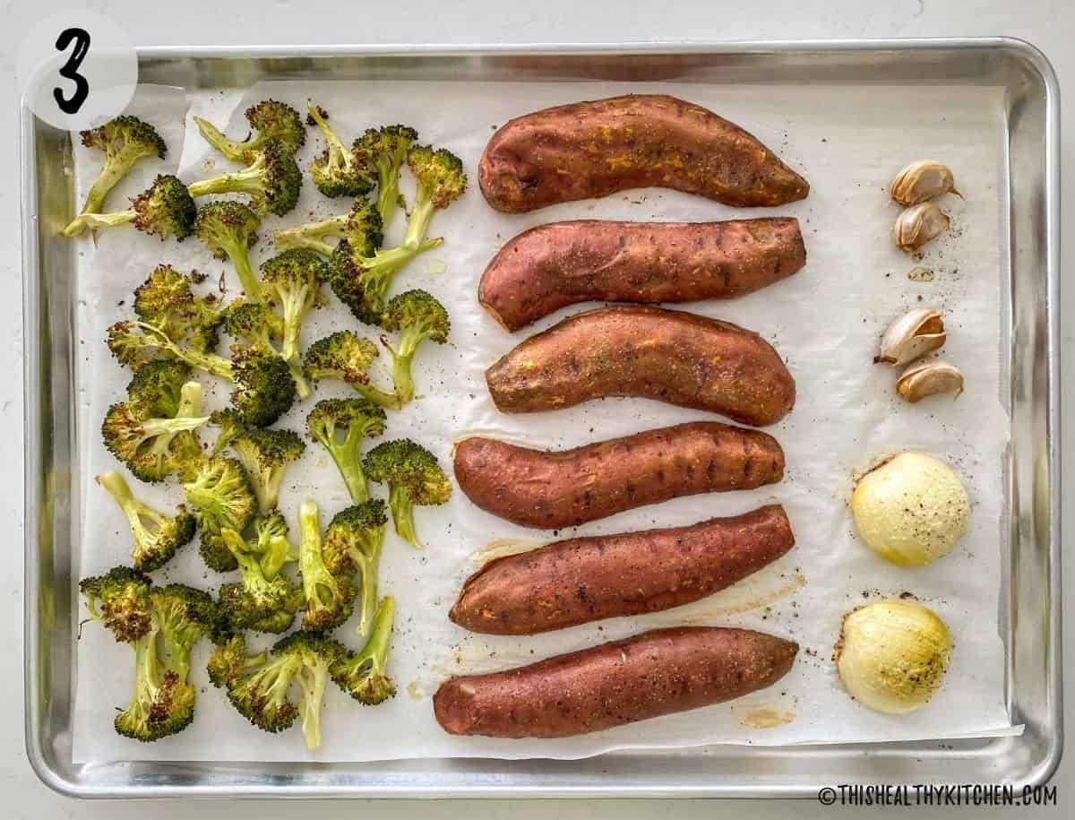Pan with roasted broccoli, sweet potatoes, onion and garlic.