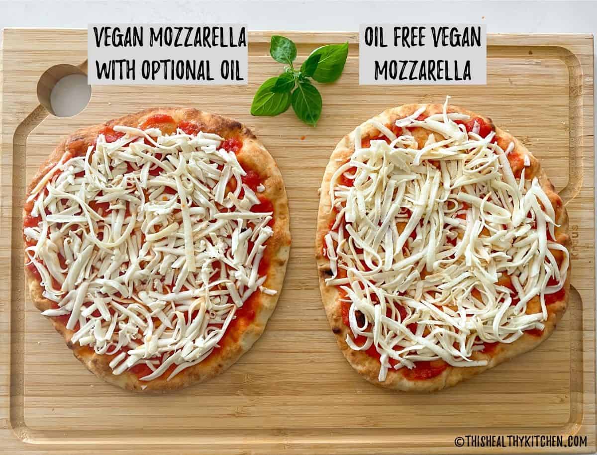 Two flatbread pizzas side by side on cutting board with vegan mozzarella on top before baking.