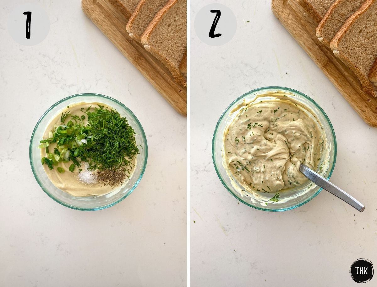Bowl of cream cheese with spices and herbs being mixed into it.