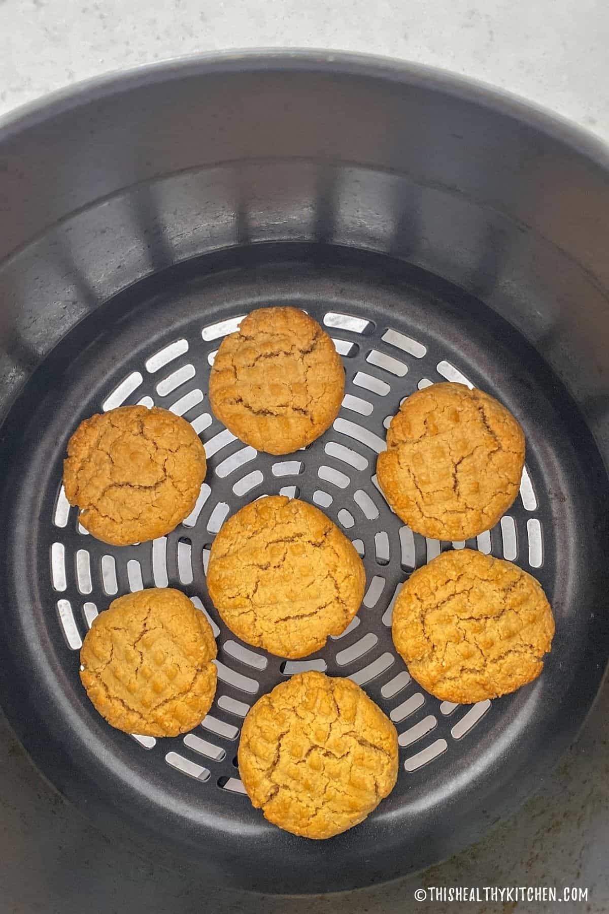 Baked cookies inside air frying basket.