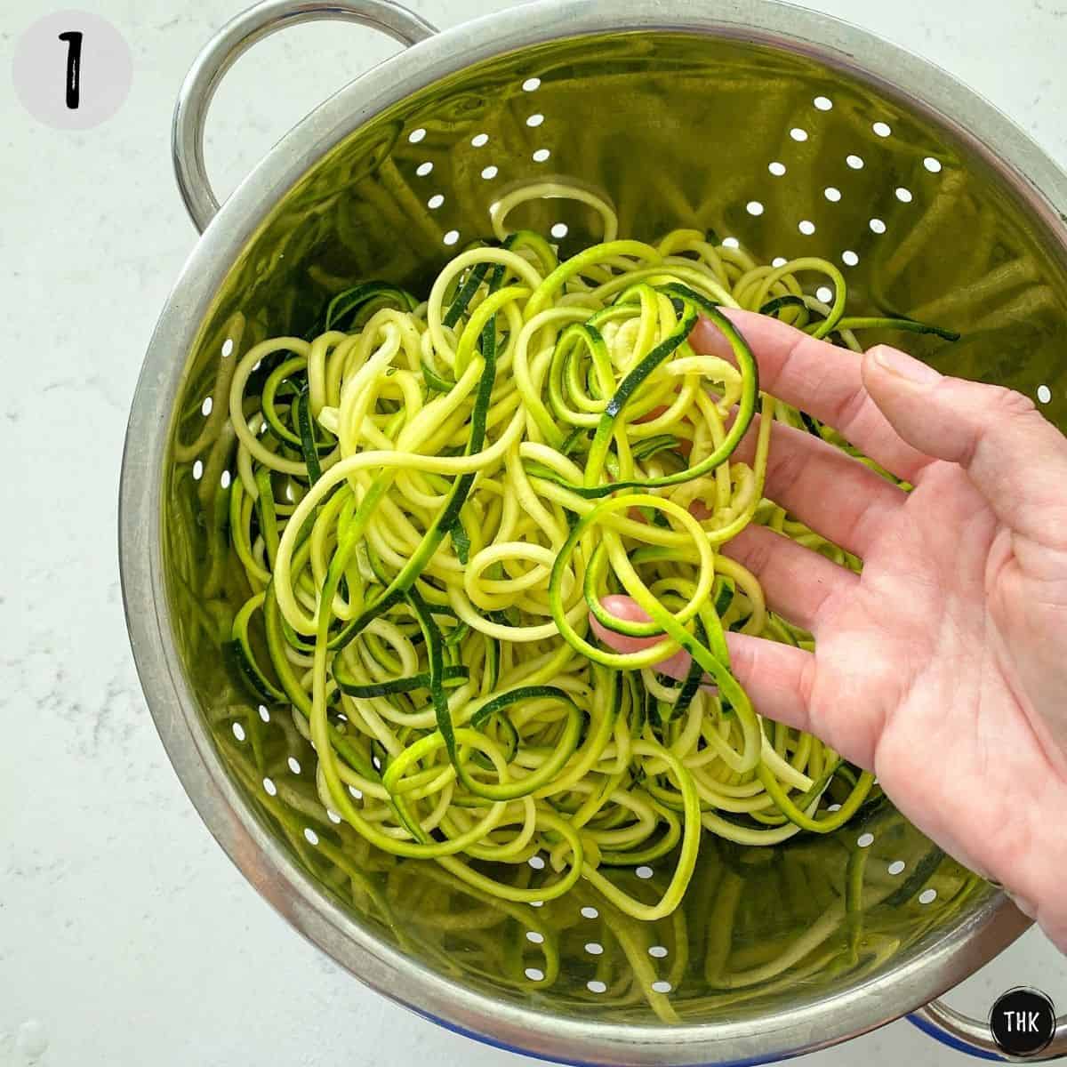 Spiralized zucchini noodles in colander.