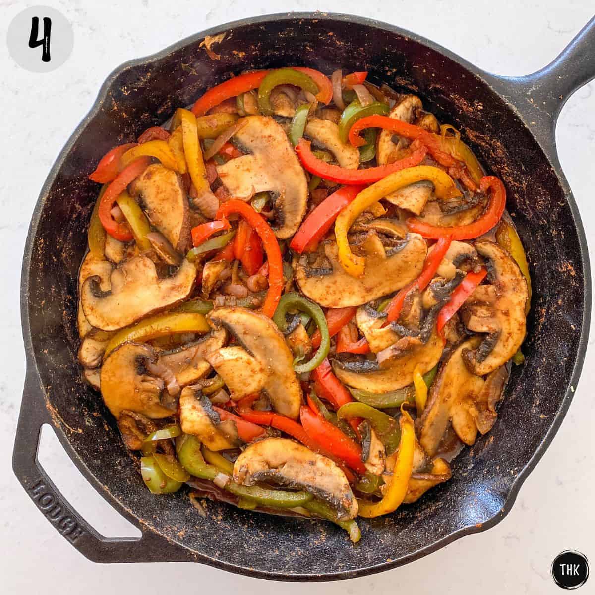 Sautéed mushrooms, peppers and onions in large cast iron skillet.