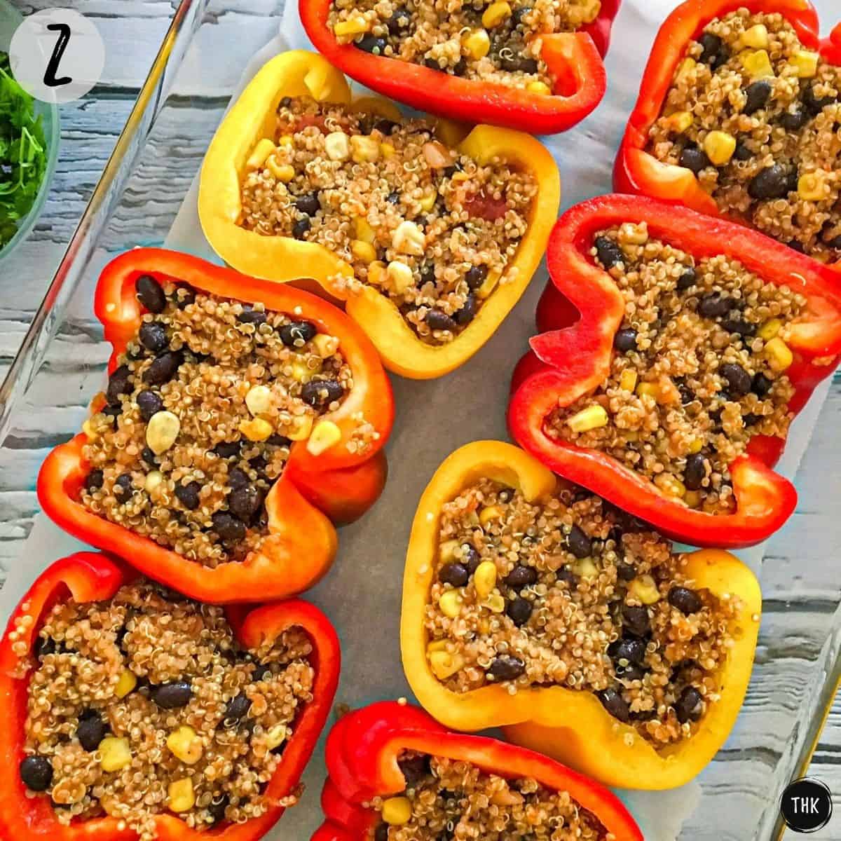 Bell pepper halves stuffed with quinoa, beans and corn.