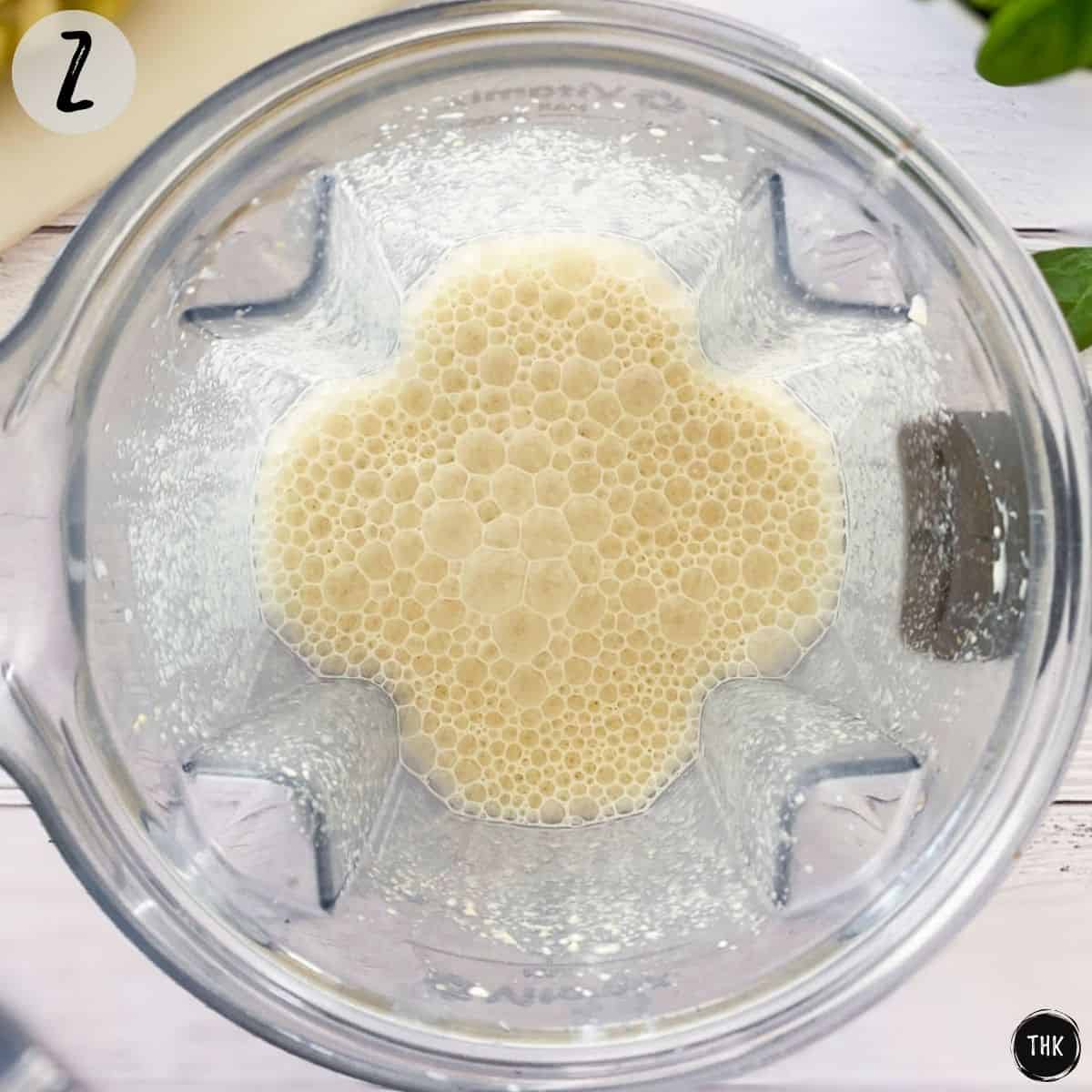 White blended liquid inside blender.