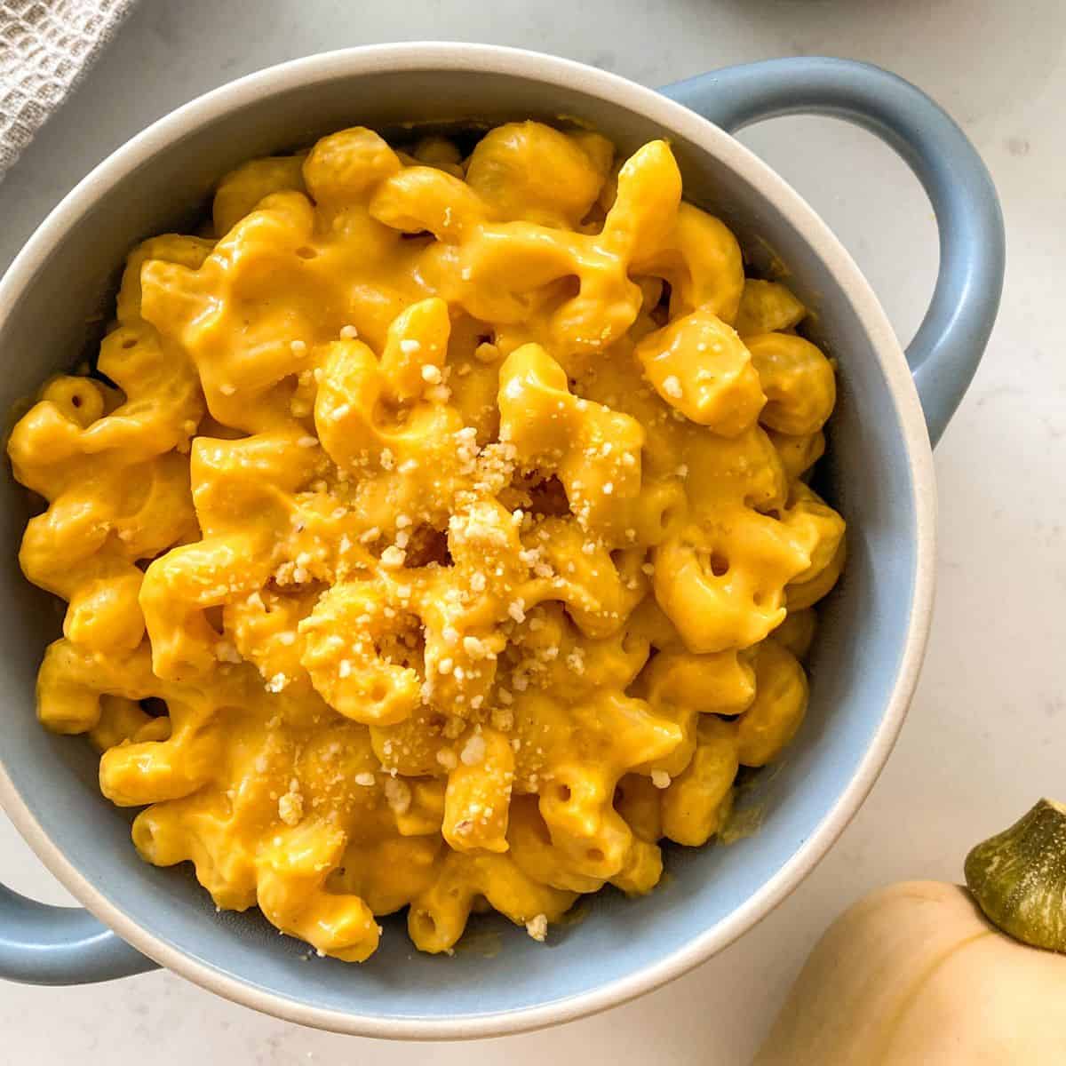 Bowl with handles filled with vegan mac and cheese.