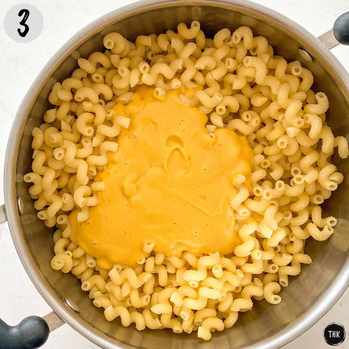 Macaroni pasta with orange sauce on top.