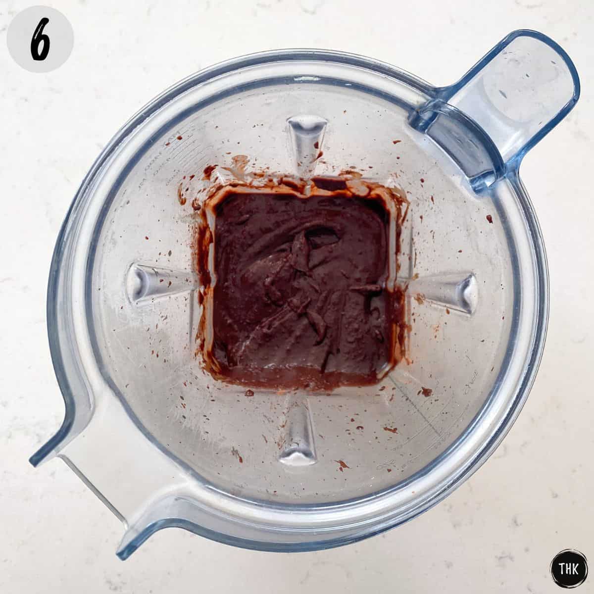 Chocolate frosting inside blender.