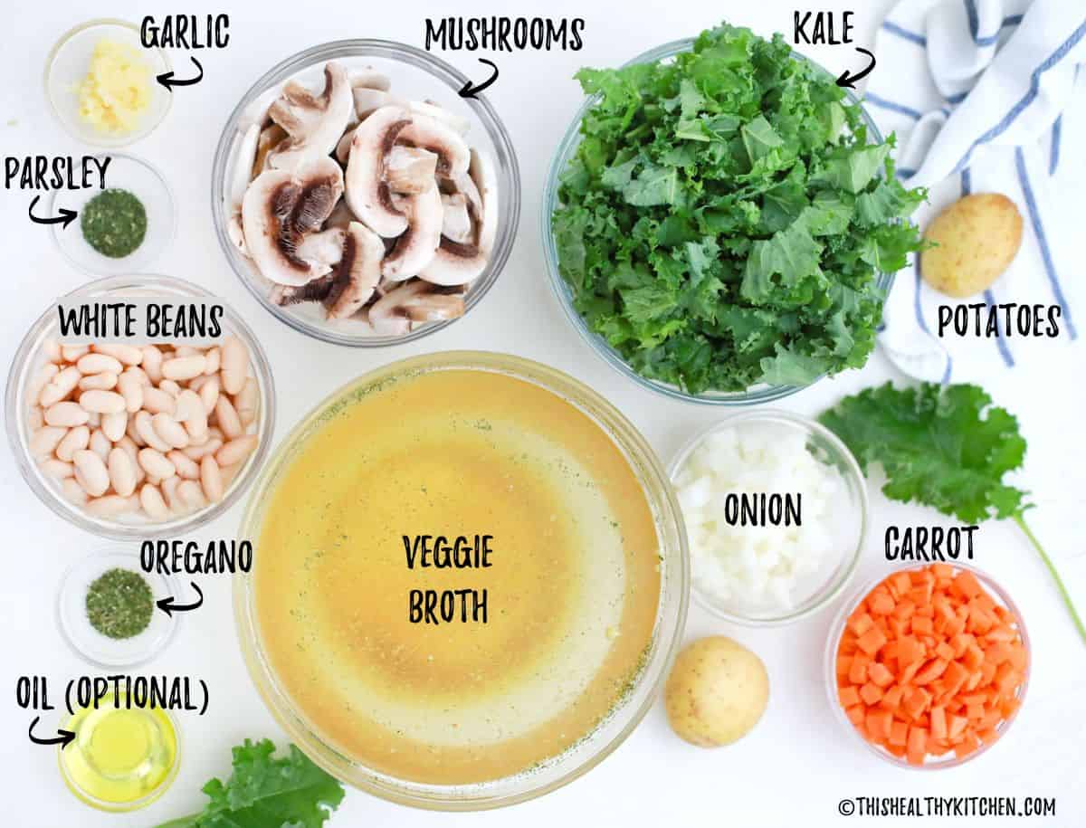 Ingredients needed to make vegan zuppa toscana on kitchen counter.
