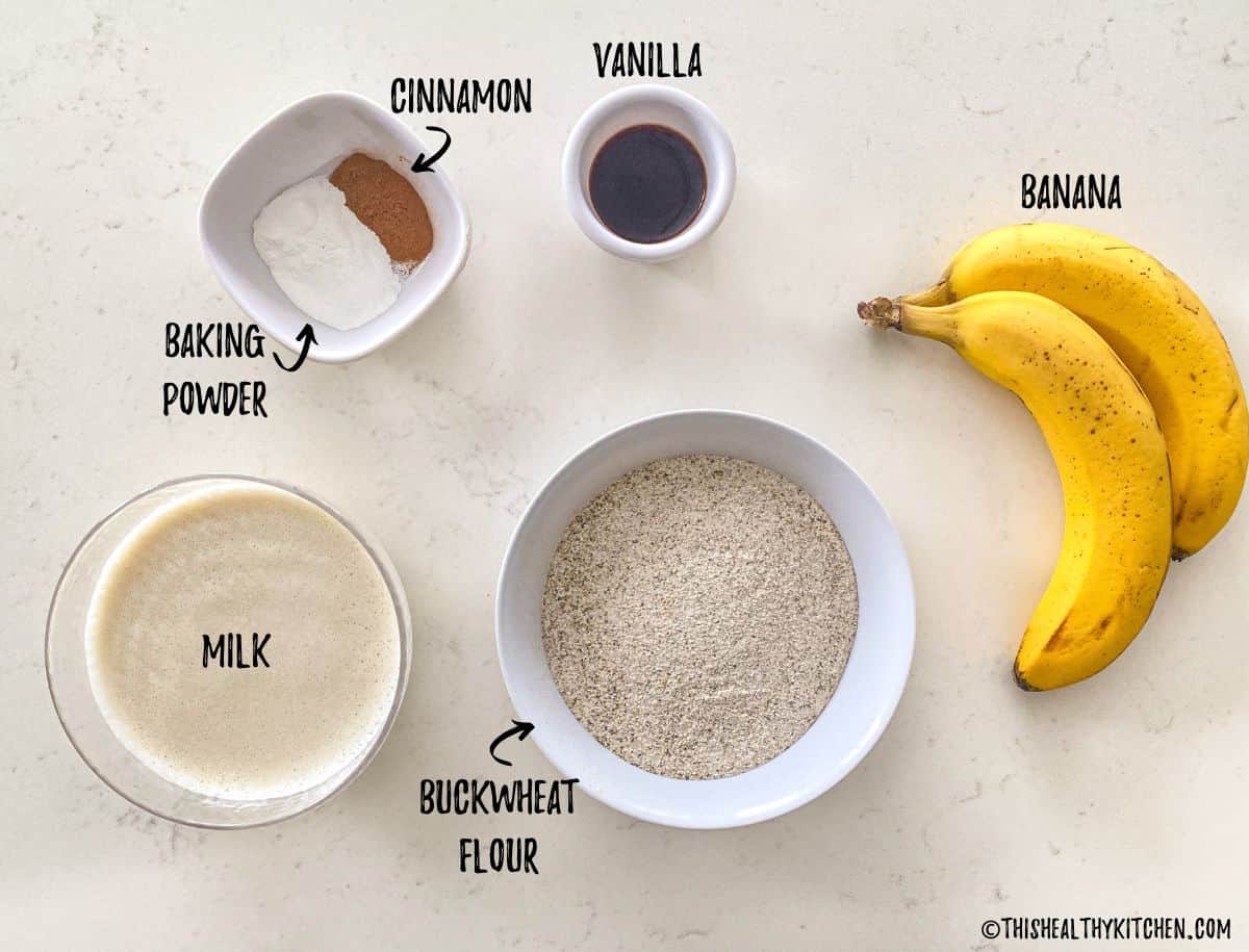 Ingredients to make buckwheat banana pancakes on kitchen counter.