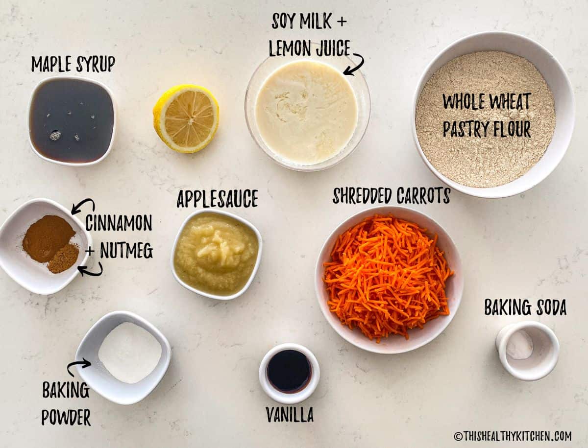Ingredients needed to make carrot cupcakes on kitchen countertop.