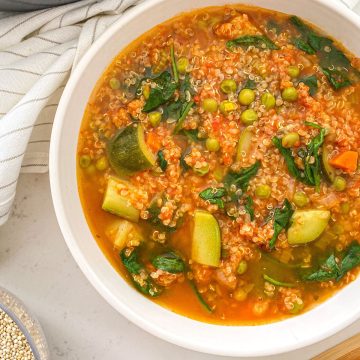 Bowl of soup with quinoa and vegetables.