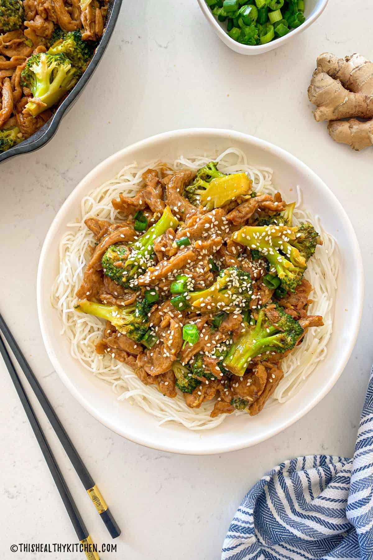 Plate with noodles and vegan beef and broccoli on top.