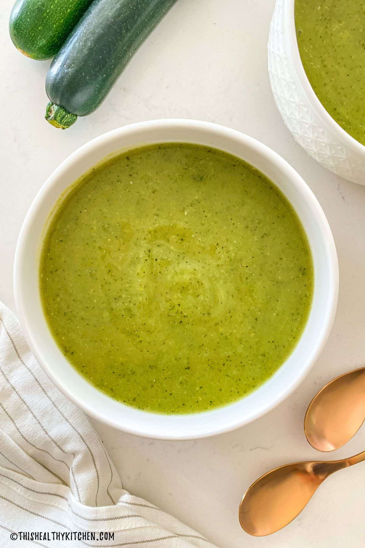 Close up of a bowl of zucchini soup.