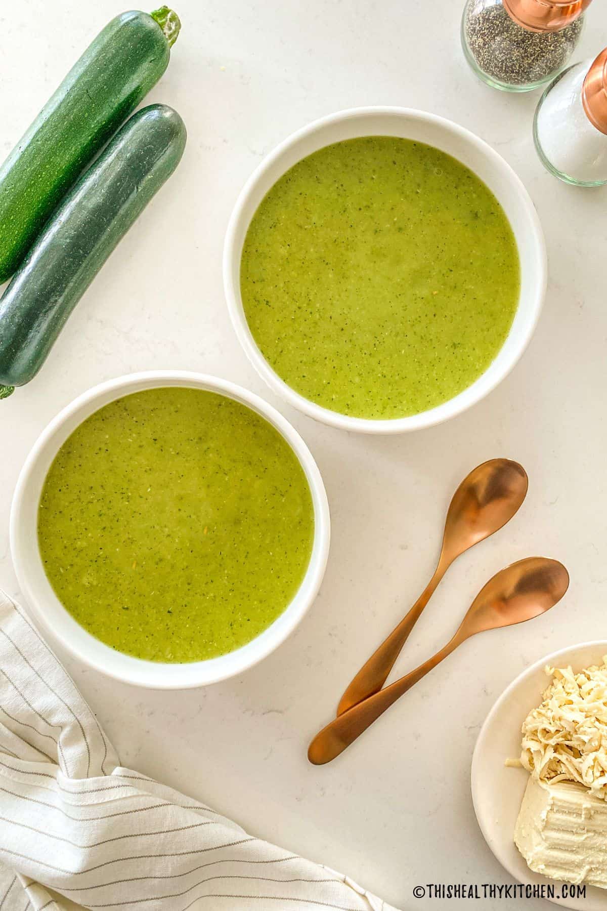 Two bowls of zucchini soup.