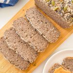 Buckwheat bread sliced on a cutting board.