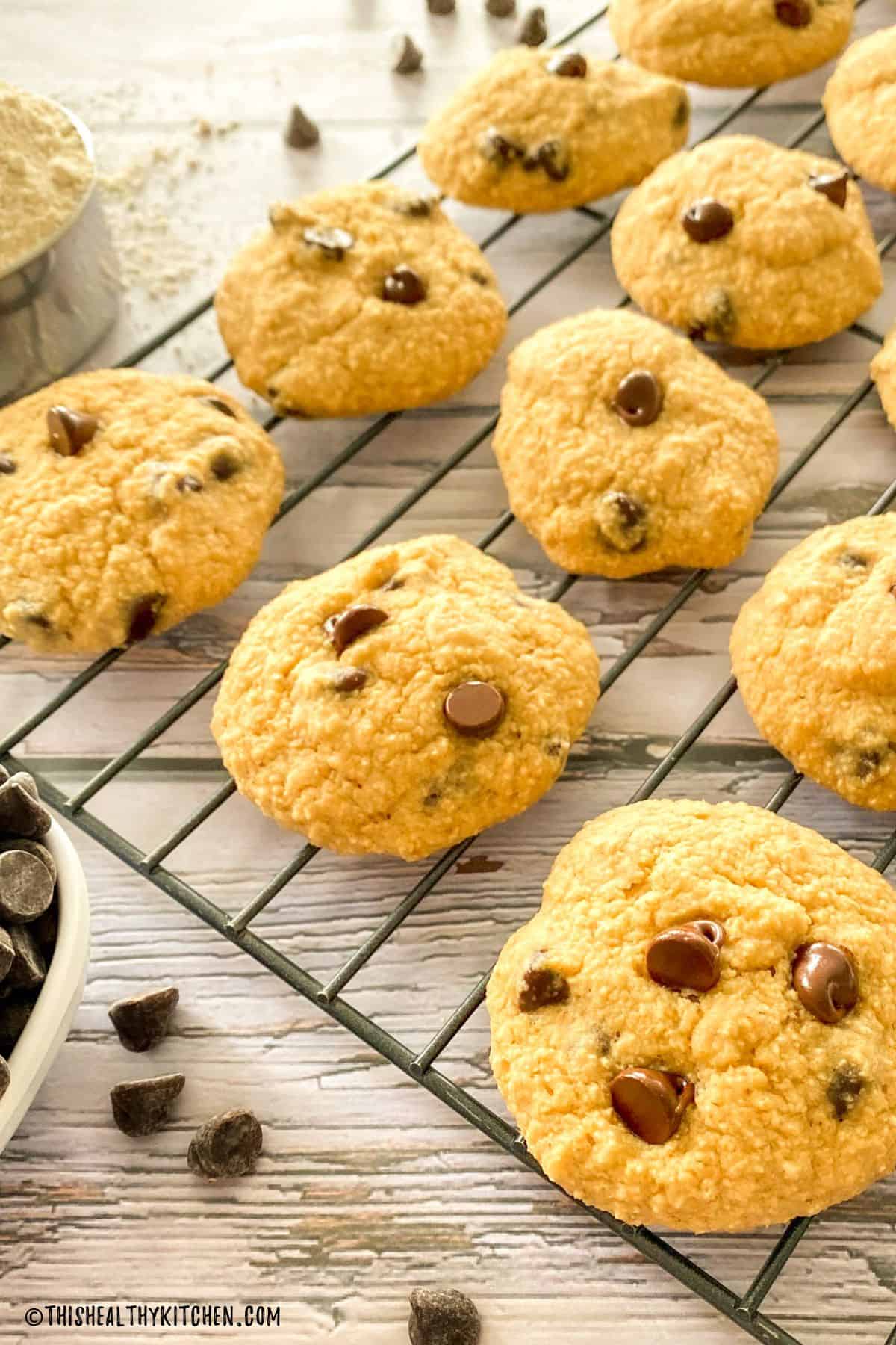 Plant based cookies with chocolate chips on a cooling rack.