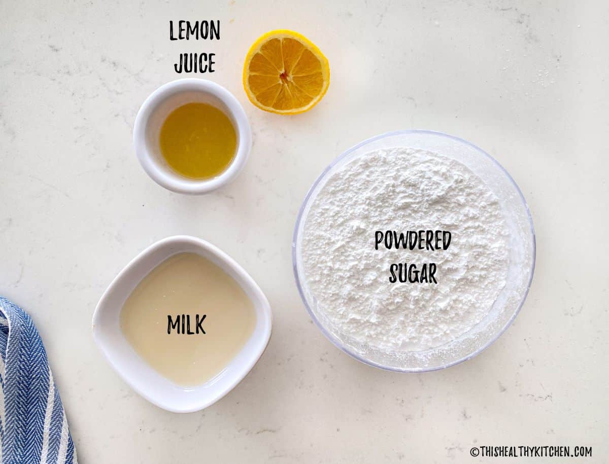 Bowl of sugar, milk and lemon juice on counter top.