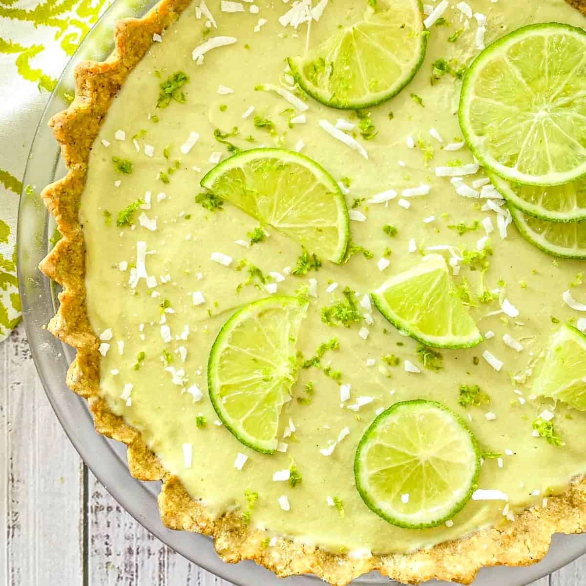 Vegan key lime pie with lime slices on top.