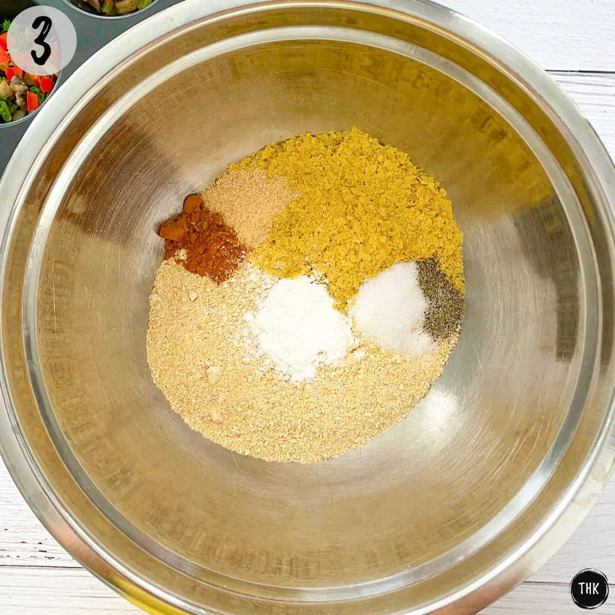 Mixing bowl with dry ingredients inside.