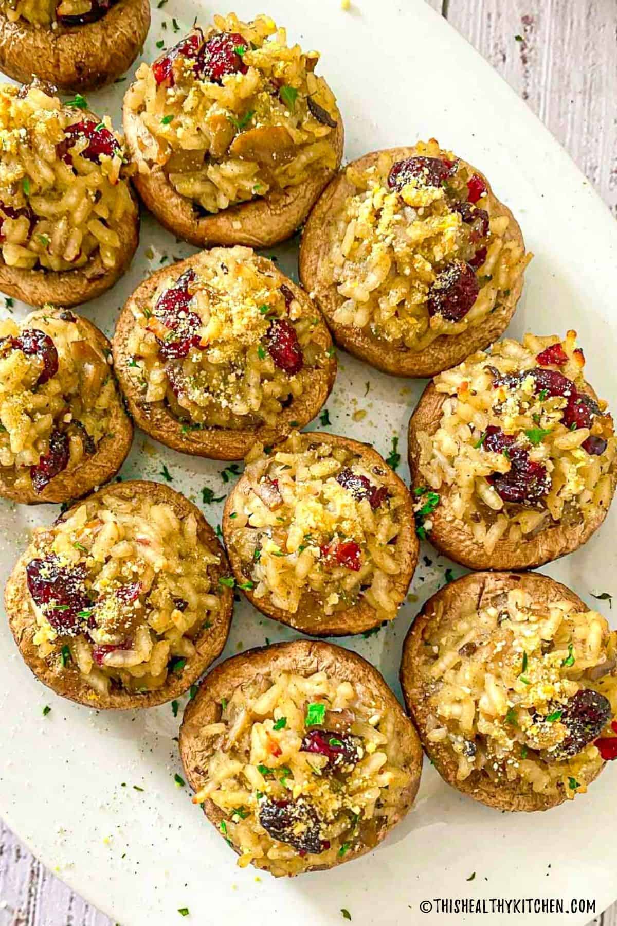 Stuffed mushrooms with risotto, cranberries and parsley on top.