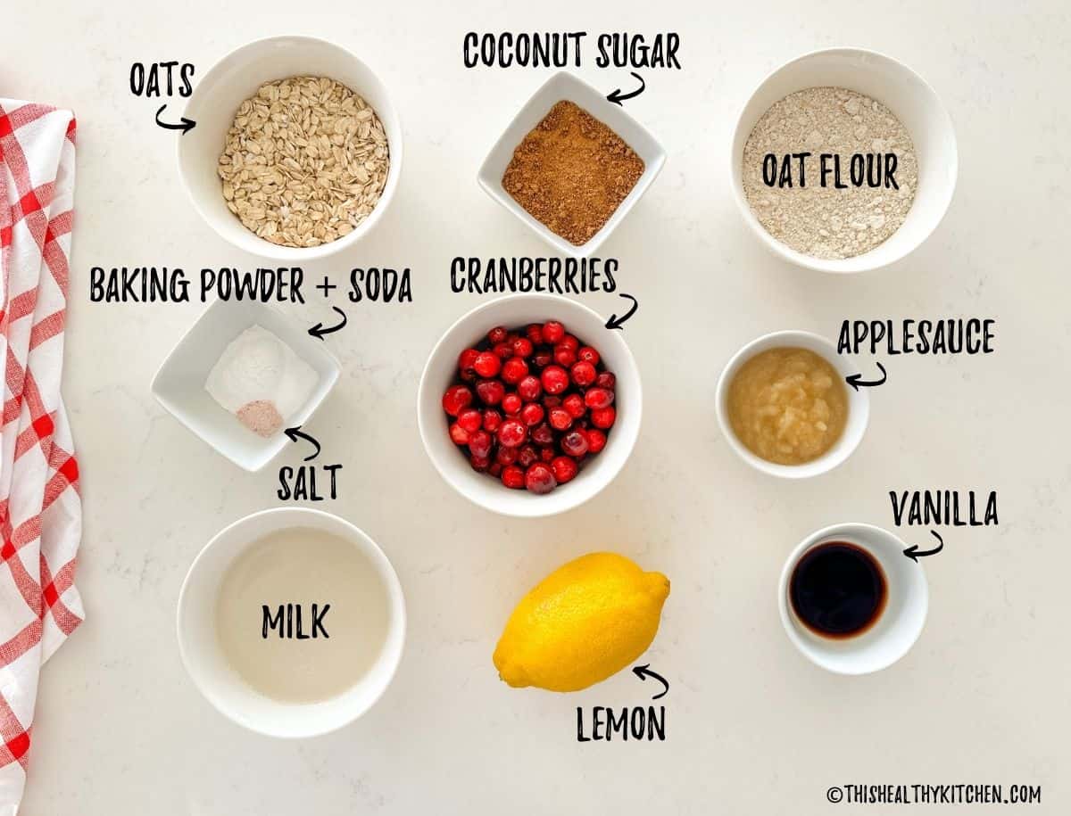Ingredients needed to make cranberry muffins in prep bowls.