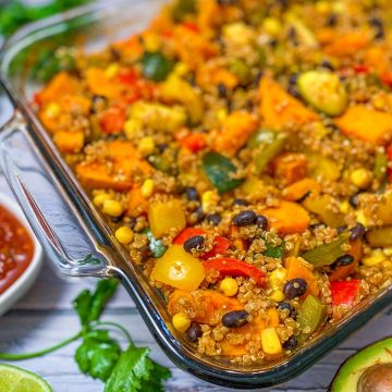 A casserole dish with black beans, corn, quinoa, sweet potato, and bell peppers.