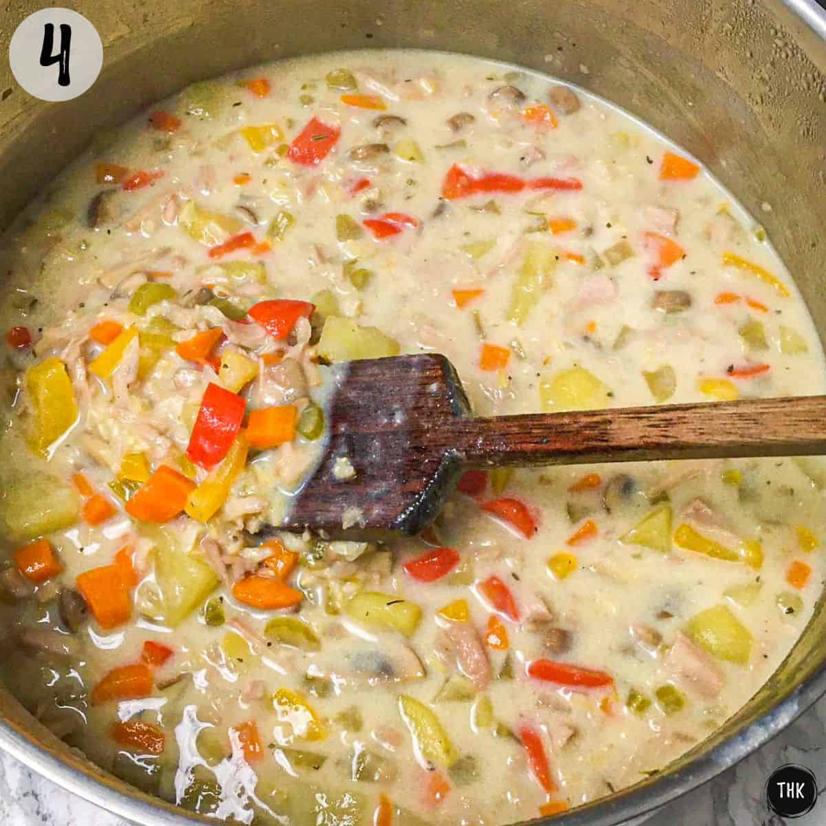 Pot of vegan chicken soup with creamy broth.