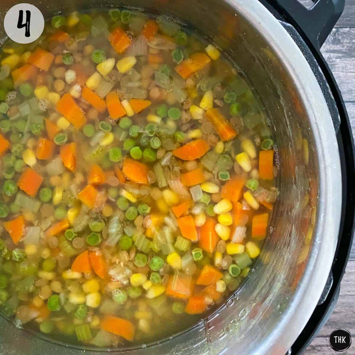 Cooked vegetable soup inside Instant Pot.