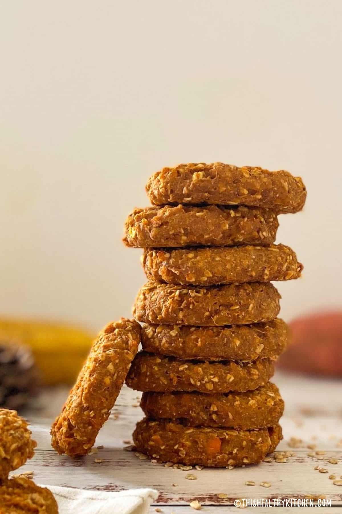 Sweet potato cookies in a stack with one leaning on its side.