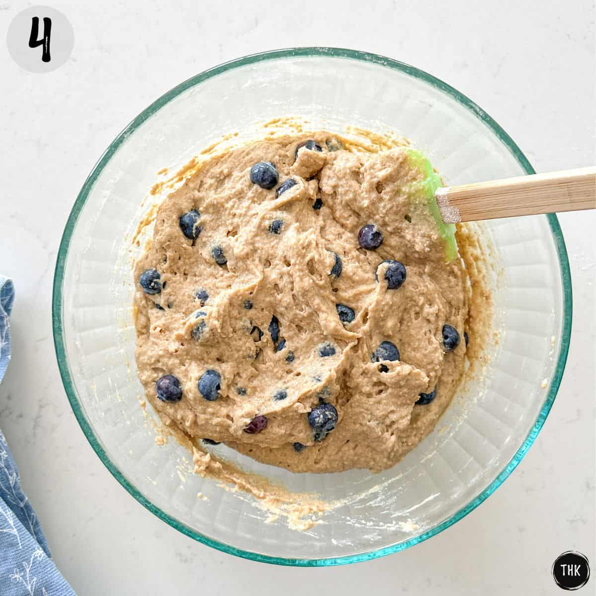 Banana lentil muffin batter with blueberries in large bowl.