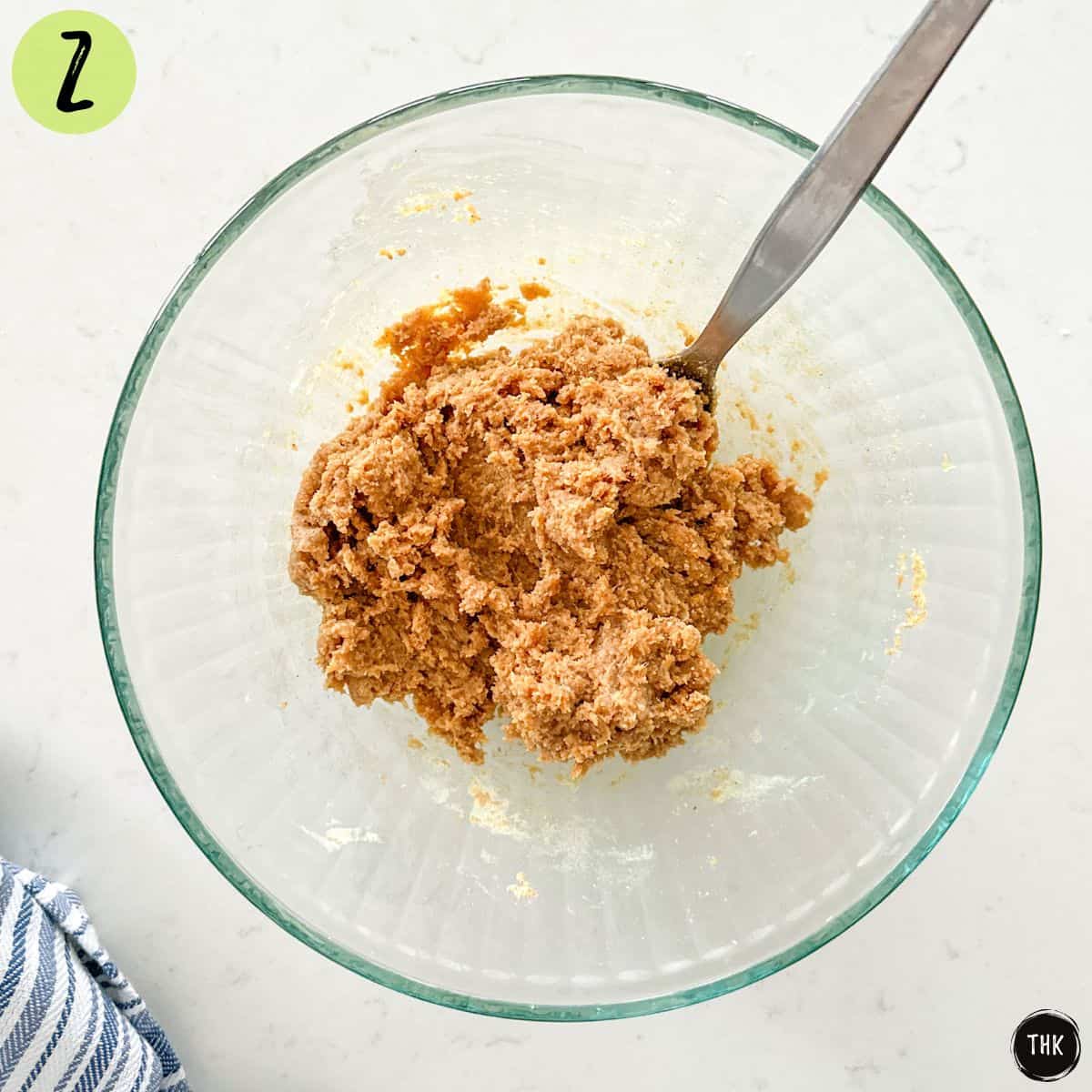 Cookie batter inside large mixing bowl.