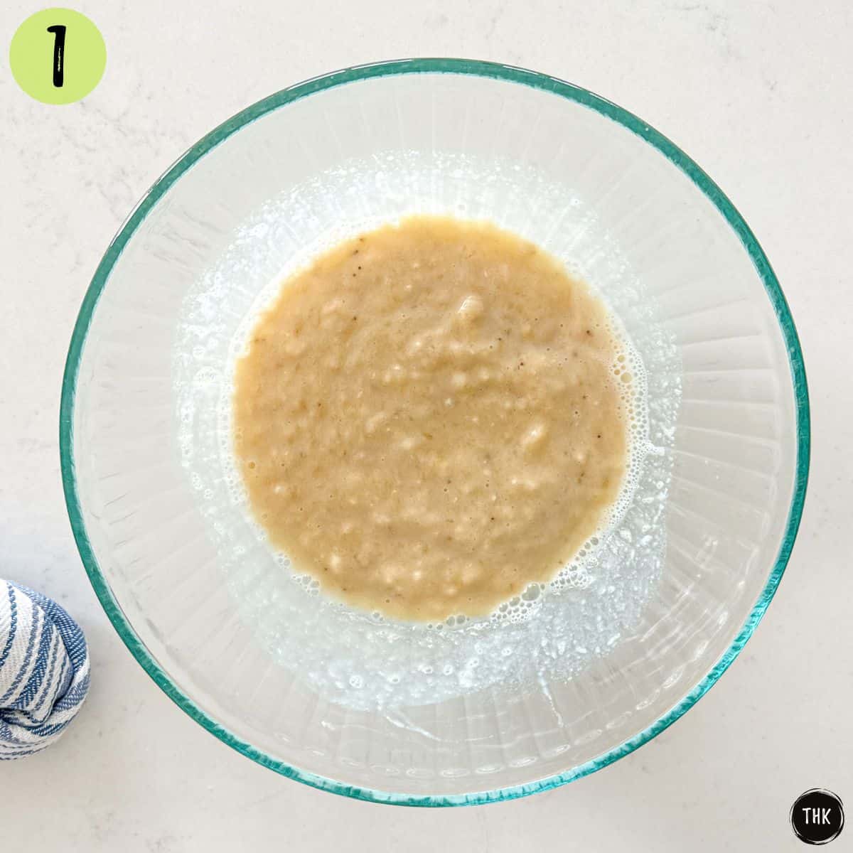 Mashed bananas and soy milk in large mixing bowl.