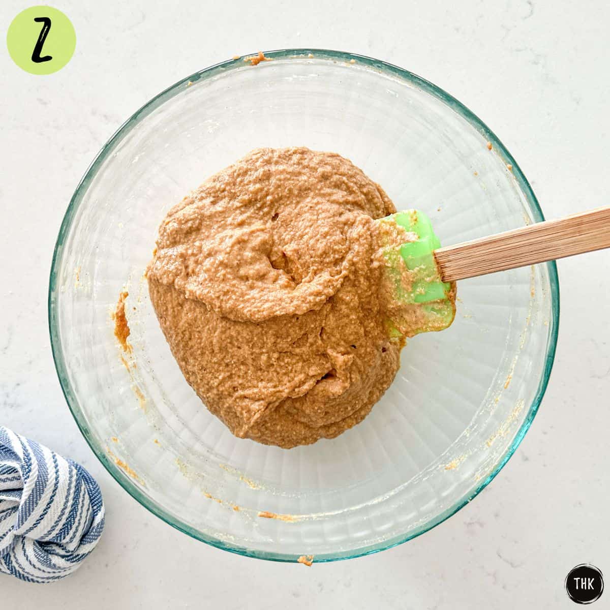 Waffle batter inside large mixing bowl.