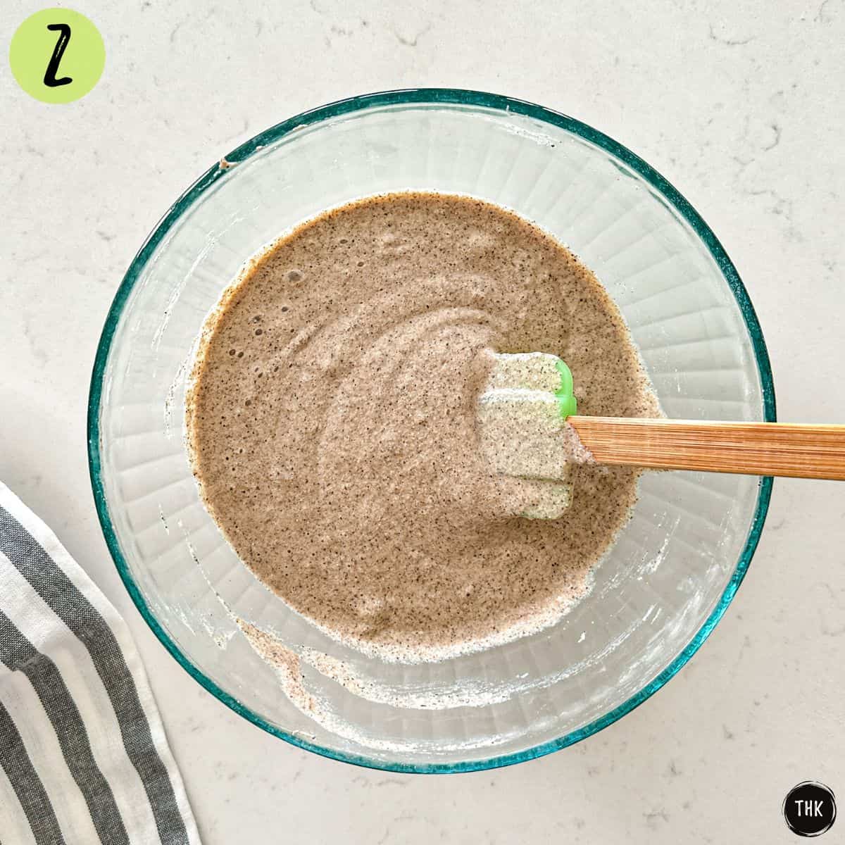 Waffle batter inside large mixing bowl.