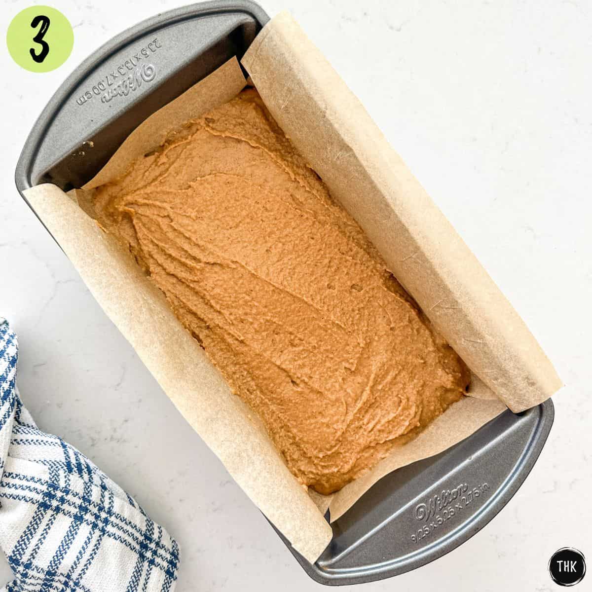 Raw blondie batter inside loaf pan.